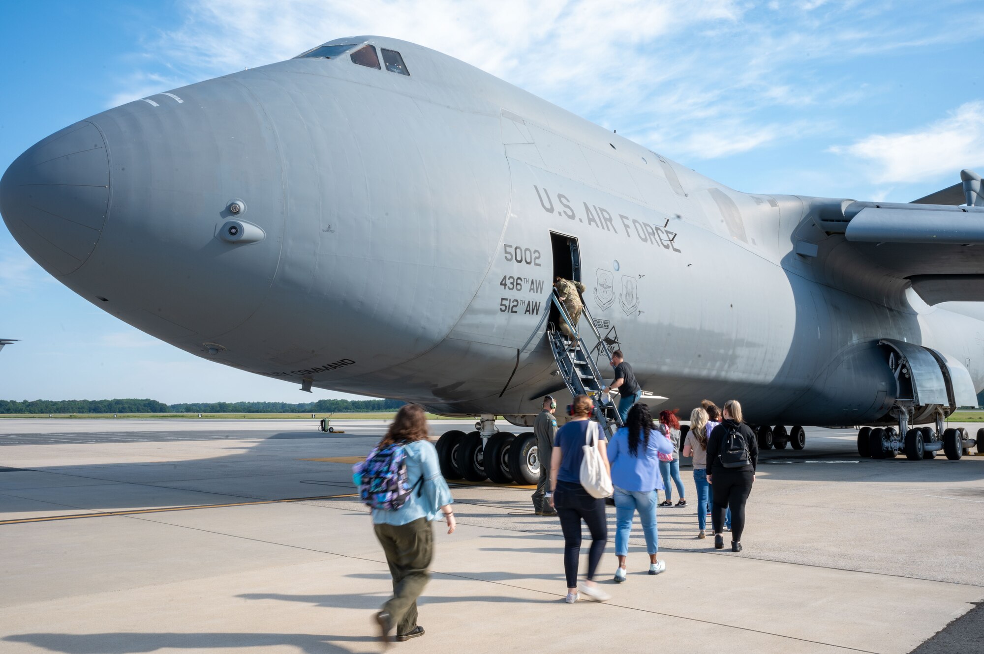 Members of the Central Delaware Chamber of Commerce Leadership Central Delaware program board a C-5M Super Galaxy before a public affairs flight at Dover Air Force Base, Delaware, June 12, 2024. The LCD members flew with the 9th Airlift Squadron as part of a community engagement opportunity to learn how Dover AFB stays prepared to deliver rapid global mobility. (U.S. Air Force photo by Senior Airman Amanda Jett)