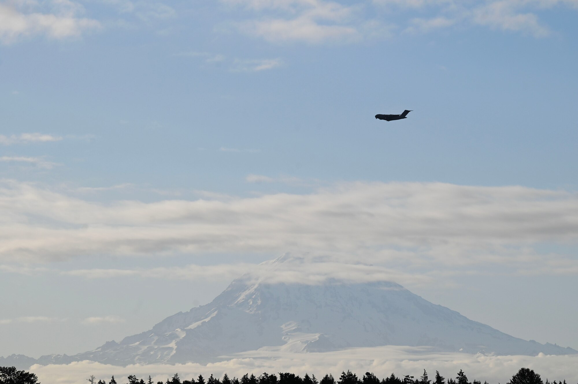 U.S. Air Force Capt. Ethan Hoder, a pilot with the 4th Airlift Squadron, prepares to take flight in a C-17 Globemaster III at Joint Base Lewis-McChord, Washington, June 12, 2024. Airmen with the 4th AS are completing a contingency mission to guarantee the execution of today’s global airlift mission. (U.S. Air Force photo by Airman 1st Class Kylee Tyus)