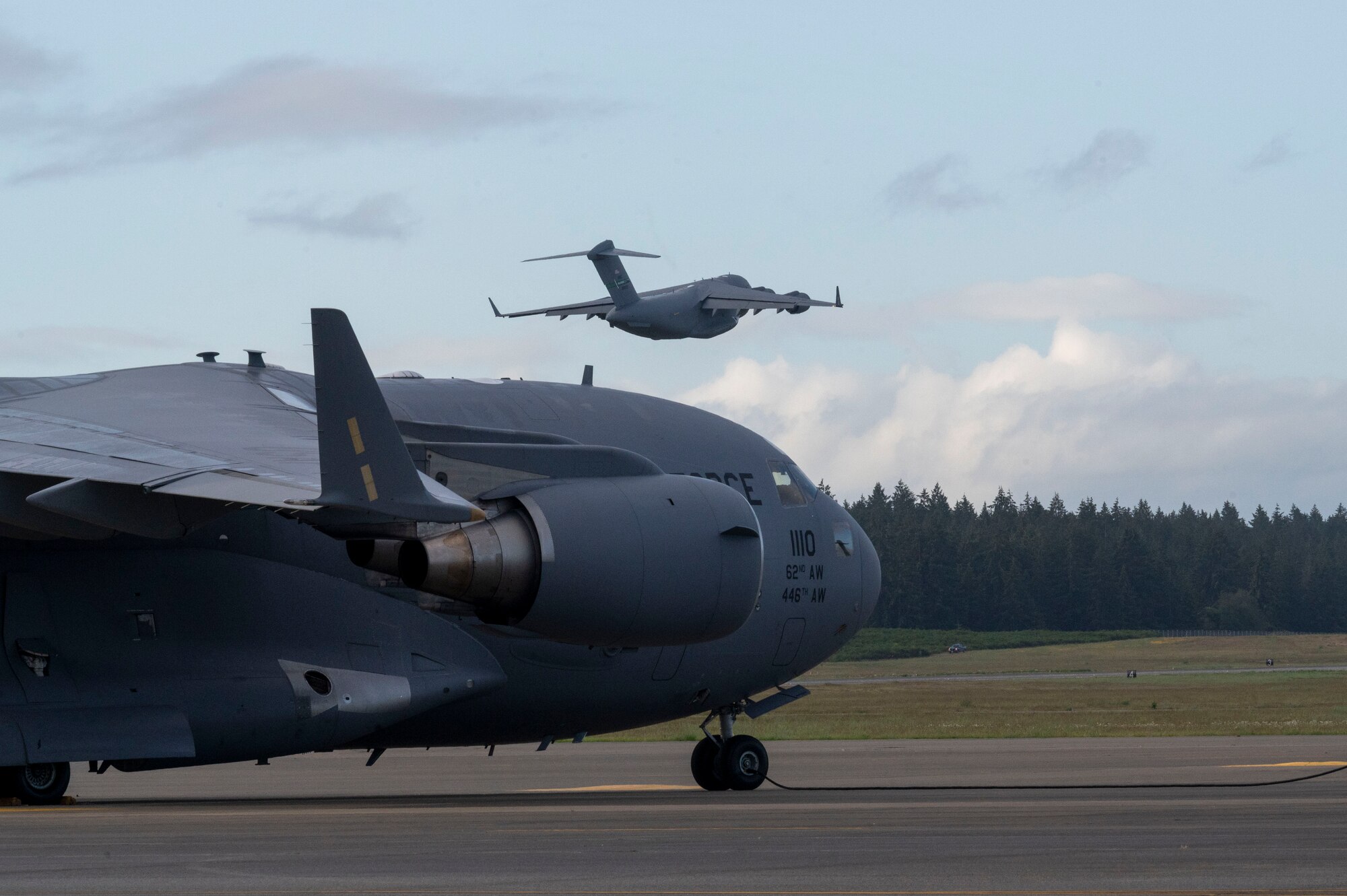 A C-17 Globemaster III piloted by U.S. Air Force Capt. Ethan Hoder, a pilot with the 4th Airlift Squadron, flies over Joint Base Lewis-McChord, Washington, June 12, 2024. Airmen with the 4th AS are completing a contingency mission to guarantee the execution of today’s global airlift mission. (U.S. Air Force photo by Senior Airman Colleen Anthony)