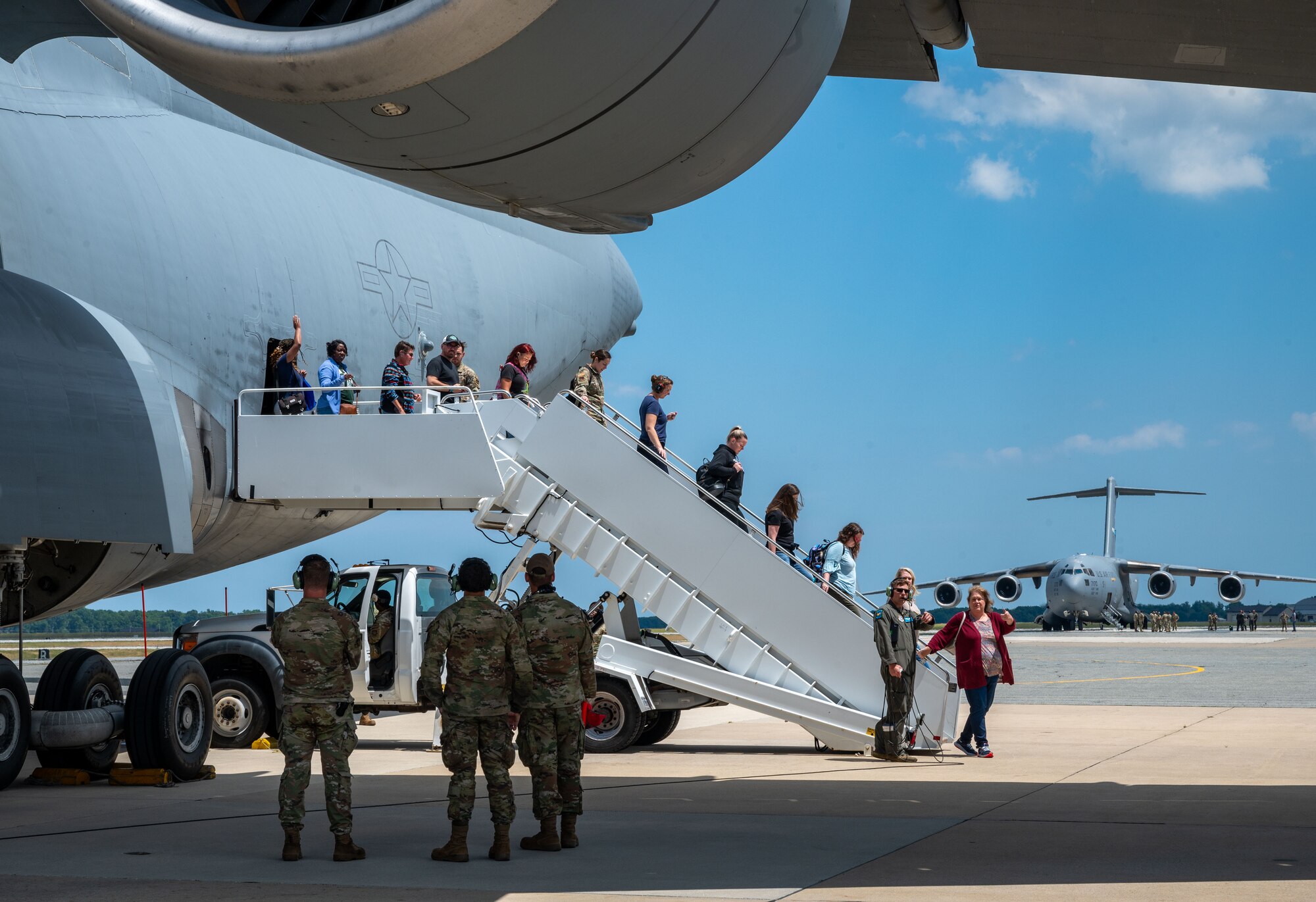 Members of the Central Delaware Chamber of Commerce Leadership Central Delaware program exit a C-5M Super Galaxy after a public affairs flight at Dover Air Force Base, Delaware, June 12, 2024. The LCD members flew with the 9th Airlift Squadron as part of a community engagement opportunity to learn how Dover AFB stays prepared to deliver rapid global mobility. (U.S. Air Force photo by Senior Airman Amanda Jett)