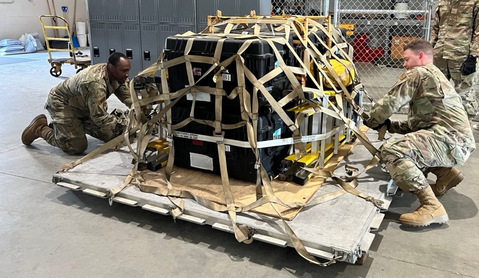 Members of the 102nd Logistics Readiness Squadron and the 212th Engineering Installation Squadron participate in pallet-building training on Otis Air National Guard Base, Massachusetts, June 4, 2024. The traffic management office (TMO) taught participants how to palletize equipment in preparation for the potential call to get materials and troops out the door in 72 hours for deployments or emergency responses.