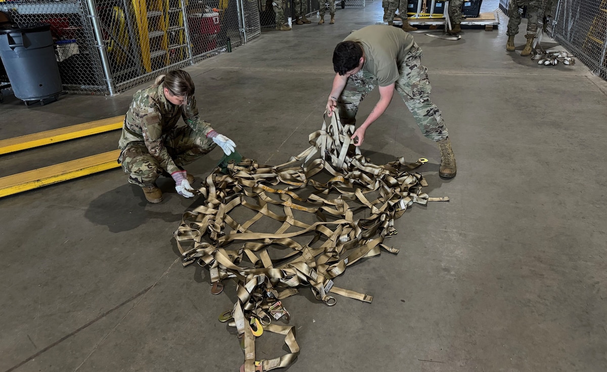 Members of the 102nd Logistics Readiness Squadron and the 212th Engineering Installation Squadron participate in pallet-building training on Otis Air National Guard Base, Massachusetts, June 4, 2024. The traffic management office (TMO) taught participants how to palletize equipment in preparation for the potential call to get materials and troops out the door in 72 hours for deployments or emergency responses.