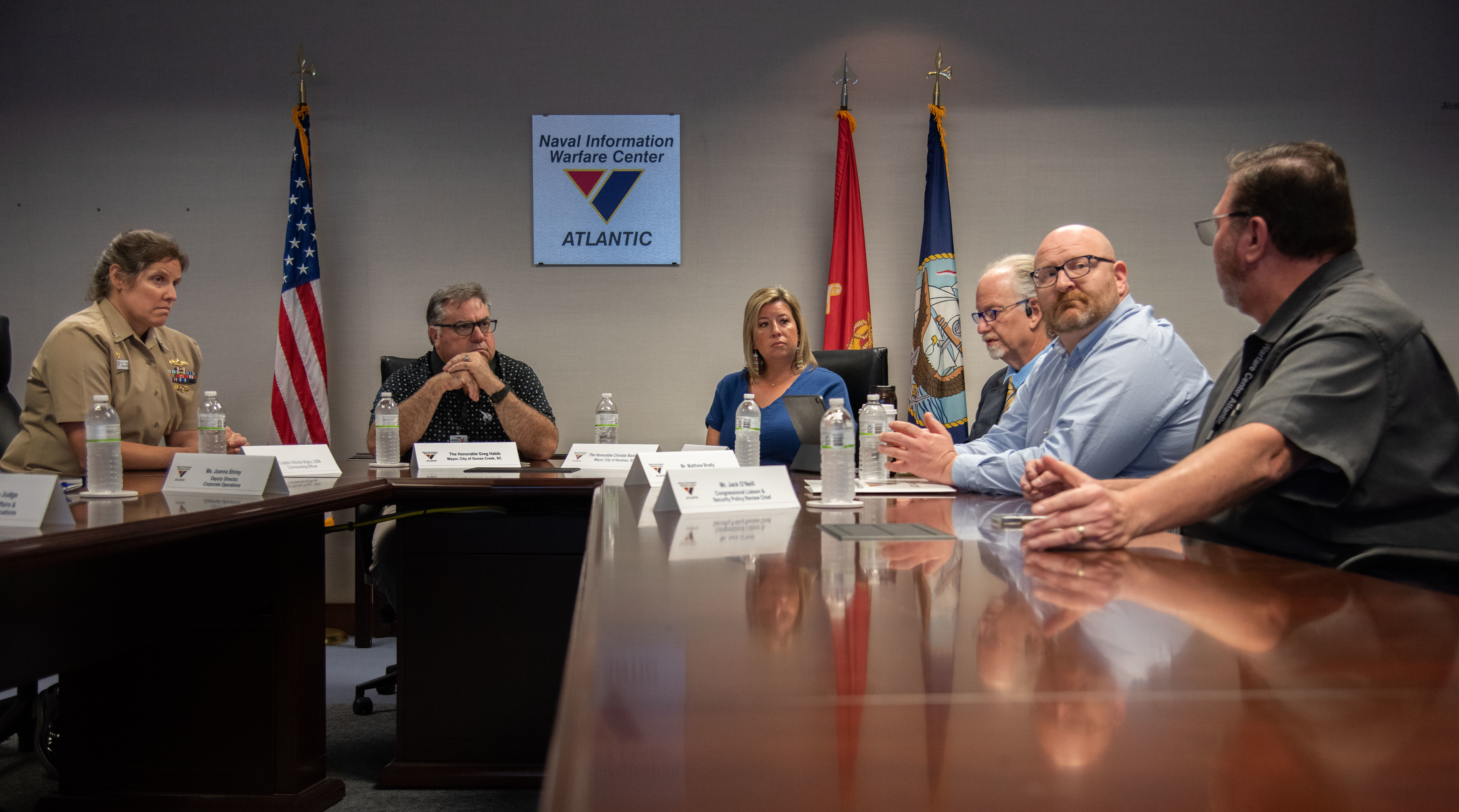 Left to right, Captain Nicole Nigro, Commanding Officer Naval Information Warfare Center (NIWC) Atlantic, meets with Mayor’s Gregory Habib, Goose Creek, SC, and Christie Rainwater, Hanahan, SC, along with Matt Matthew Brady, Economic Development Officer, Mount Pleasant, SC, second from bottom left, prior to a tour of NIWC Atlantic.  (U.S. Navy photo by Joe Bullinger)