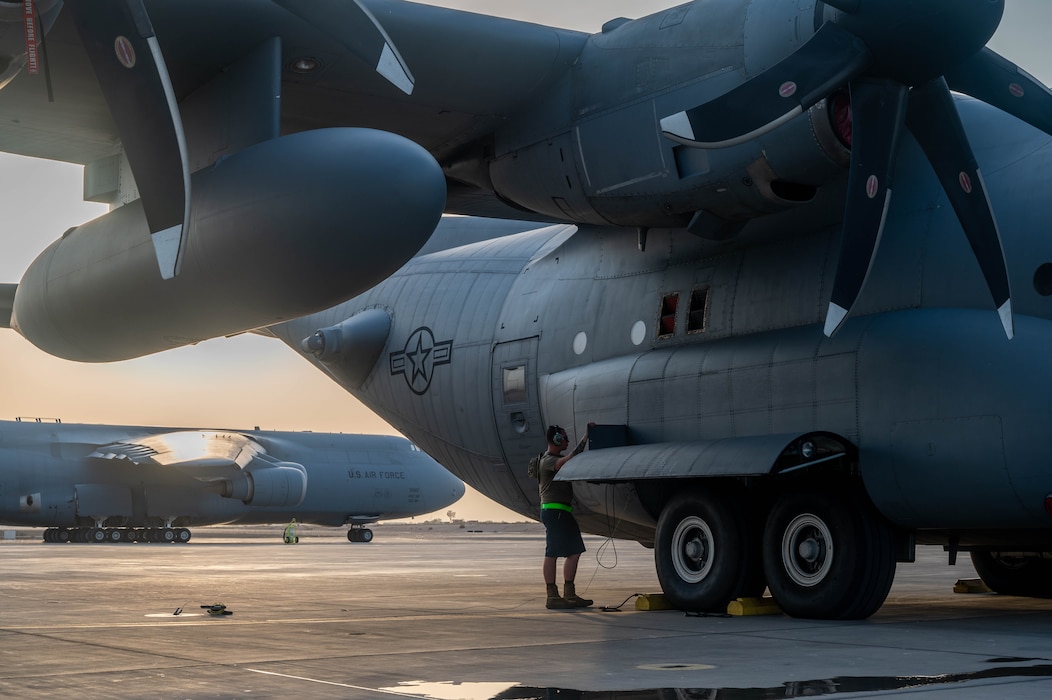 U.S. Air Force Senior Airman Tristen Horrocks, 75th Expeditionary Airlift Squadron crew chief, refuels a C-130H Hercules