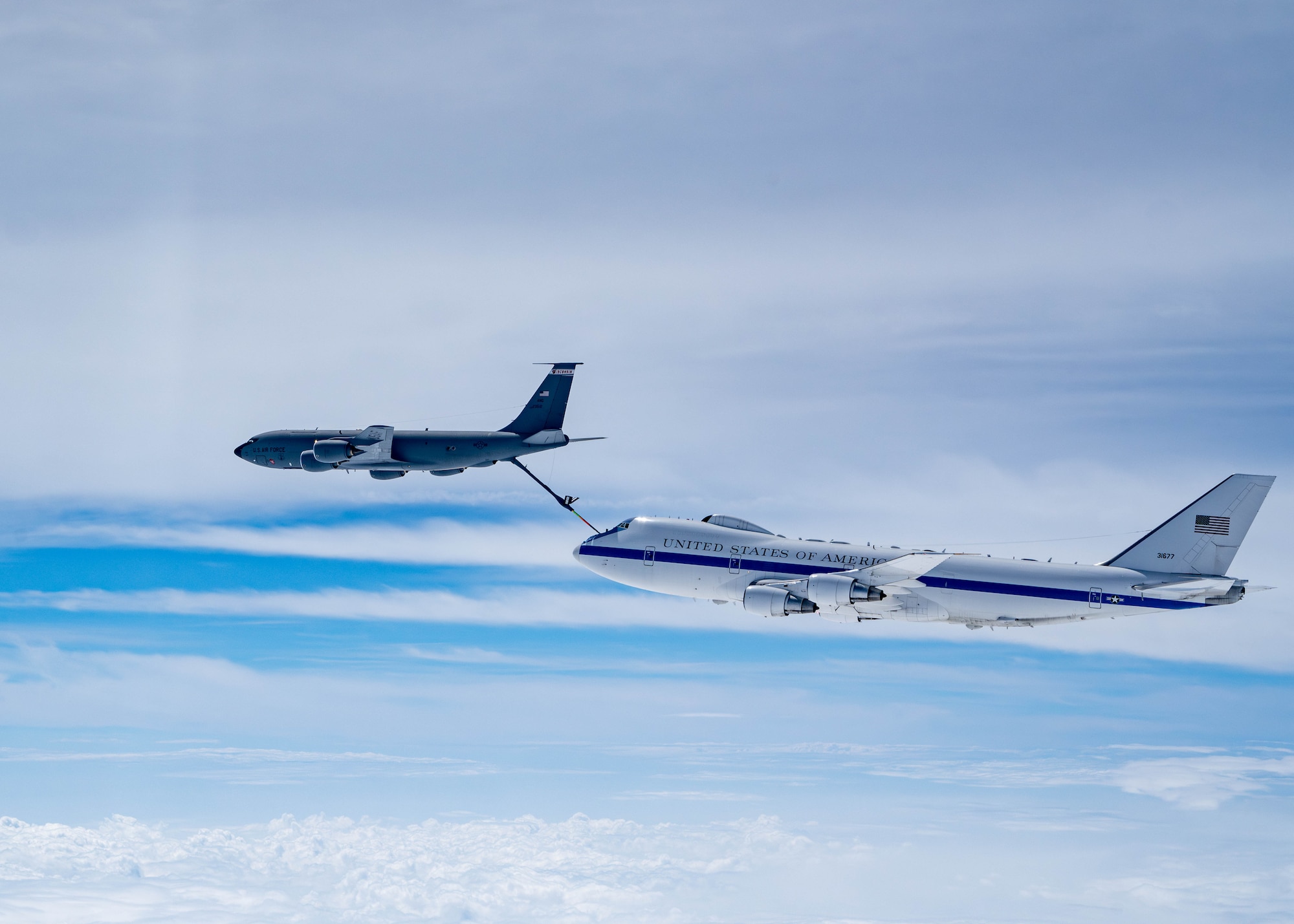 A U.S. Air Force E-4B assigned to the 595th Command and Control Group, Offutt Air Force Base, Neb., prepares to receive fuel from a KC-135R Stratotanker from the 126th Air Refueling Squadron, Wisconsin Air National Guard, May, 15, 2024. The E-4B is divided into six functional areas: a national command authority work area, conference room, briefing room, an operations team (battle staff) work area, communications area and a rest area, including seating for up to 111 crew members. (U.S. Air Force photo by Tech. Sgt. Codie Trimble)
