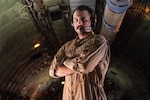 A boom operator assigned to the 350th Expeditionary Air Refueling Squadron poses for a photo at an undisclosed location within the U.S. Central Command area or responsibility, May 29, 2024. The 350th EARS, more commonly known as the “Red Falcons,” trace their lineage back to the 100th Bombardment Group, or the “Bloody Hundredth,” formed during World War II. The 100th BG and their stories were recently popularized in the television show “Masters of the Air.” (U.S. Air Force photo)