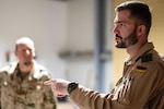A German Armed Forces representative asks questions during a tour of the U.S. Air Forces Central Task Force-99 (TF-99) facility at an undisclosed location within the U.S. Central Command area of responsibility, May 28, 2024. TF-99 is AFCENT’s premier innovation force dedicated to advancing in emerging competitive technological spaces. TF-99’s primary focus is to further evaluate drone and communication capabilities in contested and unfamiliar environments. (U.S. Air Force photo)