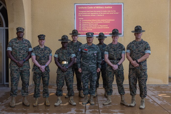 Sgt. Maj. Sang Gyun Yoon, the Republic of Korea Sergeant Major of the Marine Corps, center, and U.S. Marine Corps Sgt. Maj. Hector Soto-Rodriguez, the Sergeant Major of U.S. Marine Corps Forces Korea, pose for a photo with the leadership of Support Battalion, Recruit Training Regiment, at Marine Corps Recruit Depot San Diego, California, May 24, 2024. Sgt. Maj. Sang Gyun Yoon visited the recruit depot to gain a deeper understanding of U.S. Marine Corps training methods and to explore how these techniques could be integrated into their own Marine Corps training programs. (U.S. Marine Corps photo by Lance Cpl. Jacob B. Hutchinson)