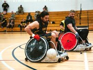 Ret. Army Sgt. Justin Mathers chases down a ball during wheelchair rugby at the 2024 Army Trials at Fort Liberty, NC.