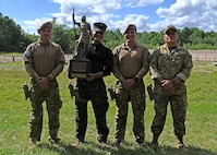 Team El Salvador hoists the Remington Centennial Trophy at the 2024 New Hampshire National Guard Combat Marksmanship Match June 8, 2024, at Fort Devens, Mass. The squad successfully defended its title as reigning champions. New Hampshire Army National Guard teams, "Cool-Guy Tabs Plus One" and "Call for Fire," placed second and third, respectively.