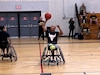 Retired Staff Sgt. Gene Calantoc steals the ball and makes the basket in a wheelchair basketball competition at the 2024 Army Trials