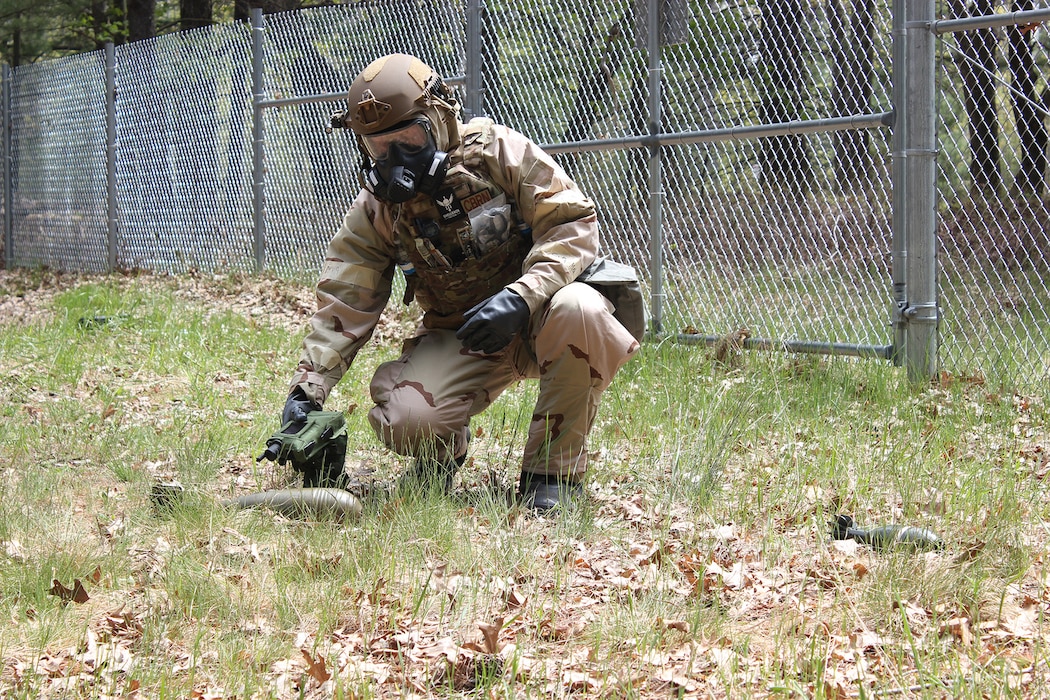 U.S. Air Force Airman First Class Tyler Litwinko, emergency management specialist with the 122nd Civil Engineer Squadron, uses a Joint Chemical Agent Detector to monitor an unexploded ordnance for chemical vapor hazards.