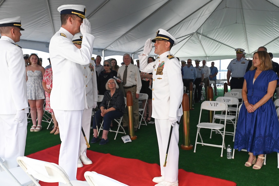 Capt. Timothy Sommella salutes Vice Adm. Nathan Moore, commander, Atlantic Area, after being relieved as commanding officer of U.S. Coast Guard Cutter Calhoun (WMSL 759) during a change-of-command ceremony, June, 11, 2024, in North Charleston, South Carolina. The change-of-command ceremony is a time-honored military tradition that marks a transfer of total authority and responsibility from one individual to another. (U.S. Coast Guard photo by Petty Officer 3rd Class Amber Mcgruder)