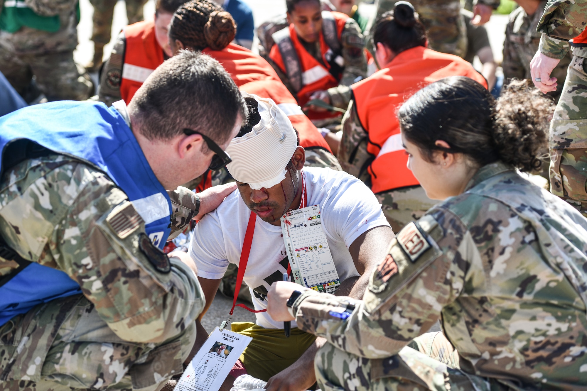 medics treat a simulated wounded person