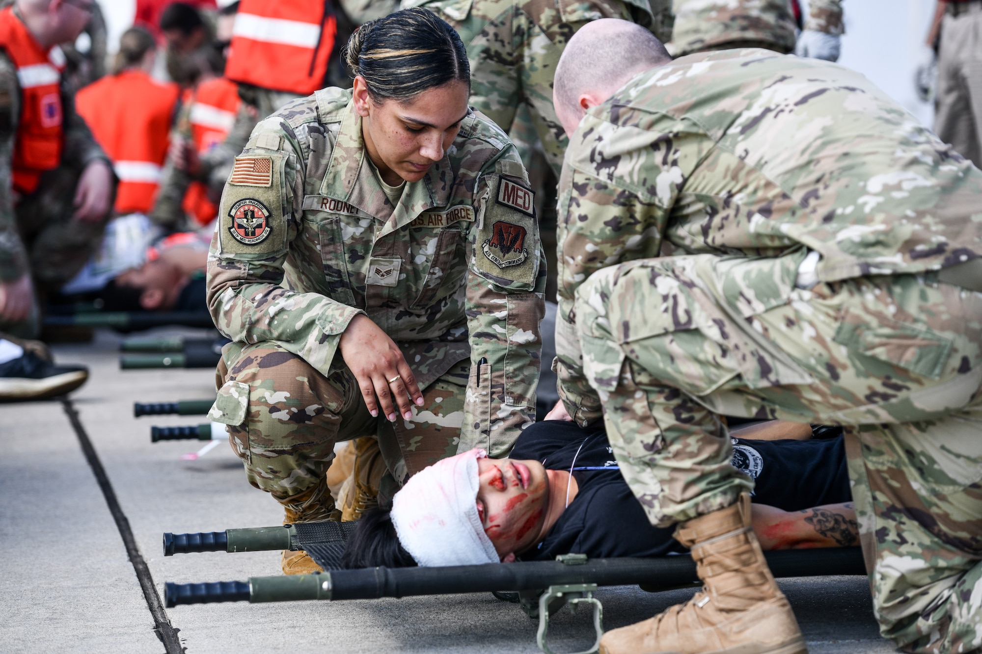 medics treat a simulated wounded person