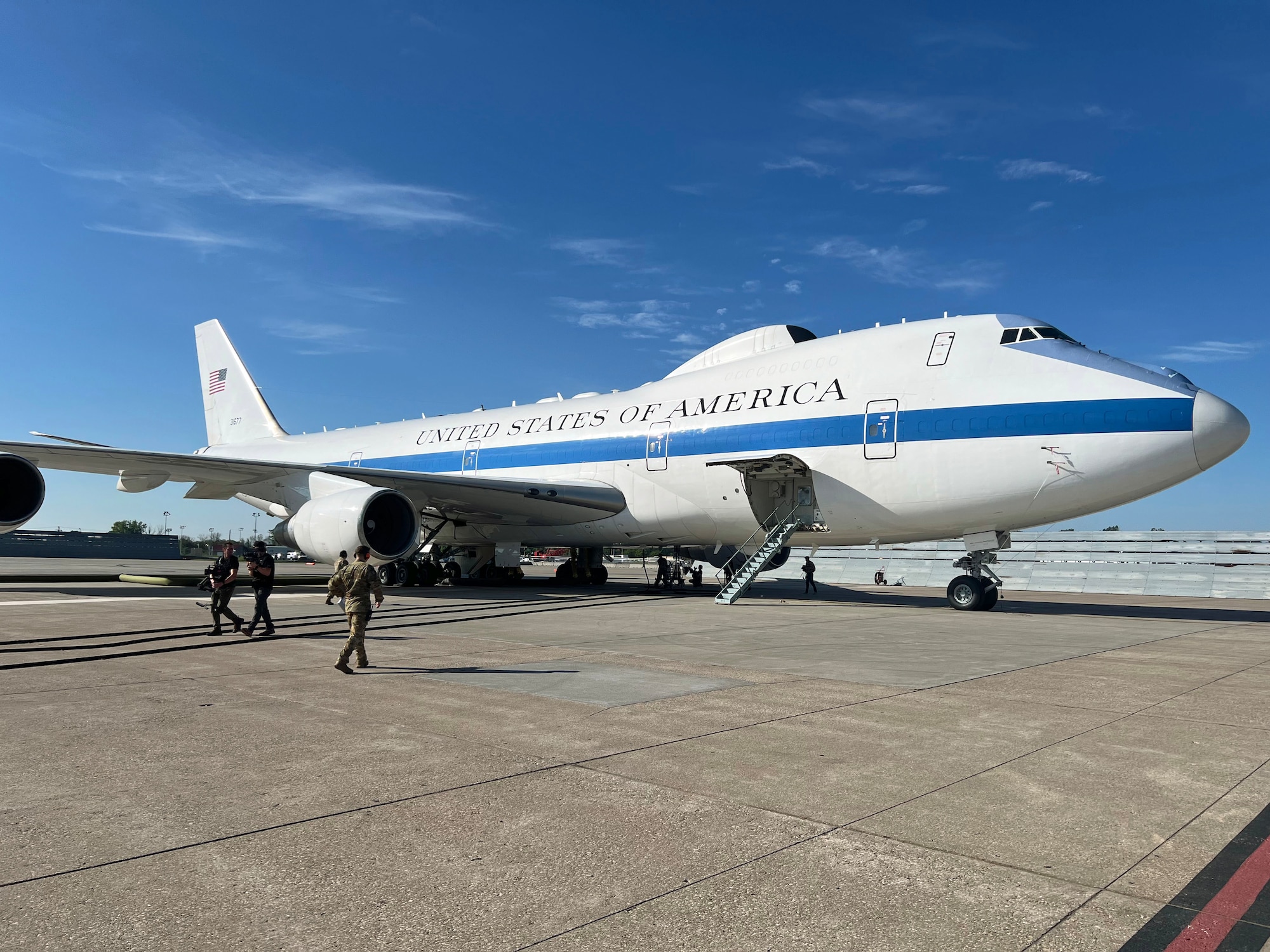 Maintainers from the 595th Aircraft Maintenance Squadron prepare the E-4B for flight as a visiting documentary production team loads onto the Nightwatch to film a local training sortie and air refueling mission from Offutt Air Force Base, Neb., May 15, 2024. (U.S. Air Force photo)