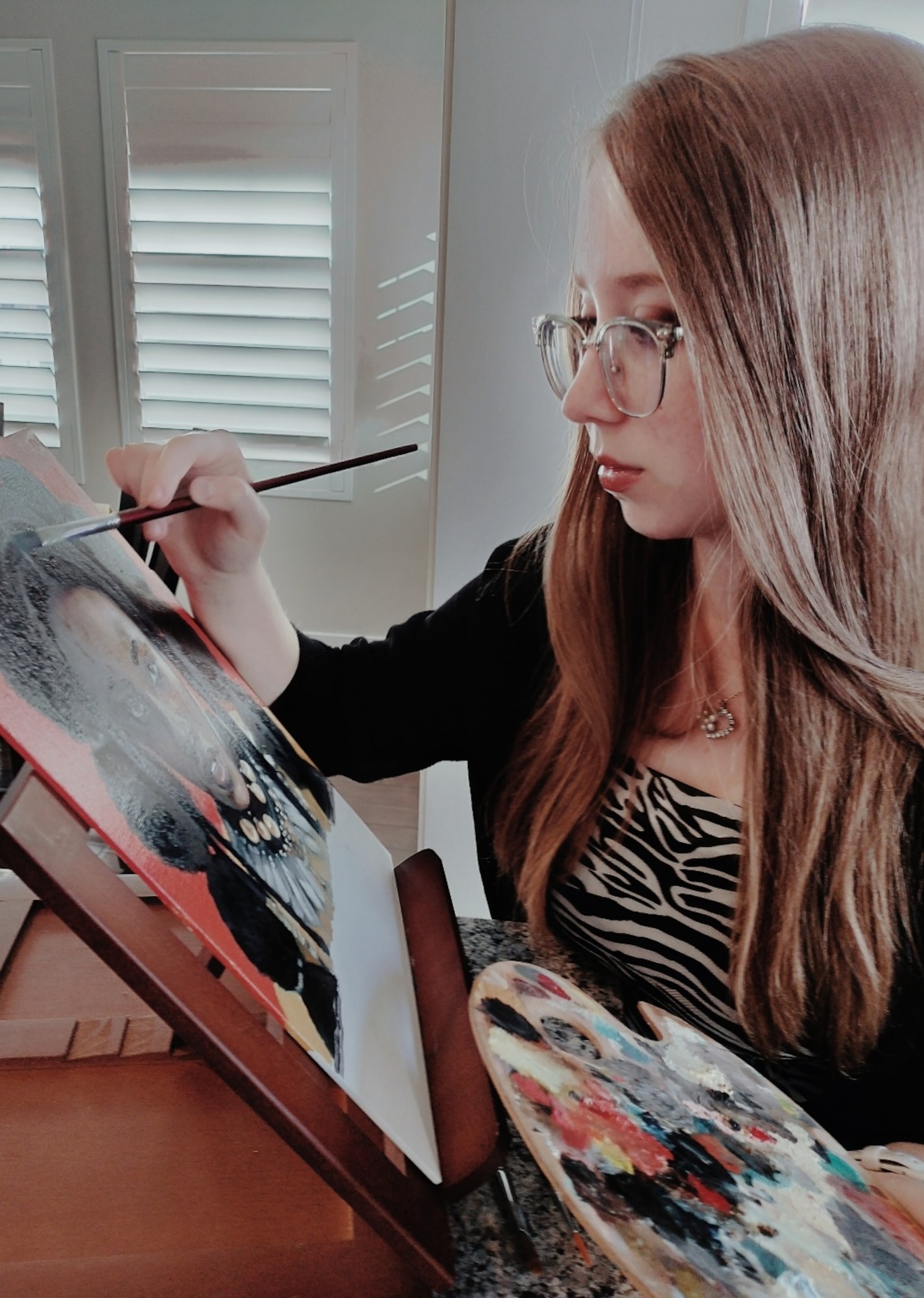 Hill AFB dependent Morgan Becker paints "Willow," which won first place in the 2024 Air Force Art Contest. Also winning first place for a 2D painting was Nicole Taggert, 309th Software Engineer Group. (Courtesy photo)