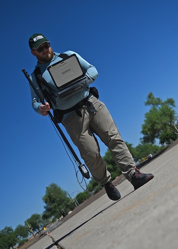 Derek Ensign, U.S. Geological Survey physical scientist, conducts hyperspectral imaging at Davis-Monthan Air Force Base, Ariz., June 11, 2024. Ensign was conducting hyperspectral imaging for the USGS Earth Mapping Resources Initiative and for sensors flown by the ER-2 to increase the nation’s geologic knowledge of critical mineral resources. (U.S. Air Force photo by Tech. Sgt. Sergio A. Gamboa)