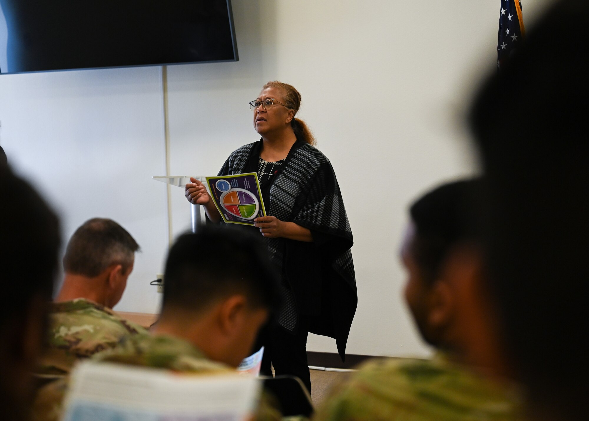 A person speaks to a crowd.