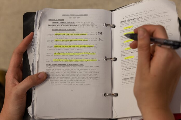 A U.S. Marine Corps recruit with Alpha Company, 1st Recruit Training Battalion, takes notes during a Tactical Combat Casualty Care class at Marine Corps Recruit Depot San Diego, California, June 5, 2024. TCCC is a three-phase approach to casualty management, ensuring the appropriate medical care is given, at the correct time and place, during any necessary scenario. (U.S. Marine Corps photo by Lance Cpl. Jacob B. Hutchinson)
