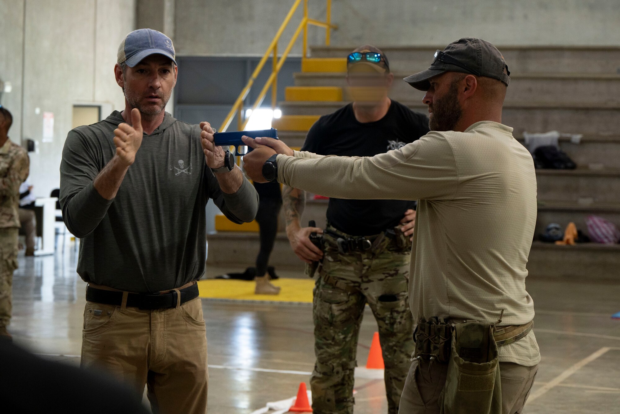 A photo of a man teaching a pistol class.