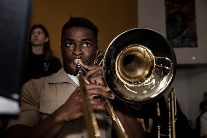 U.S. Marine Corps Sgt. Ken Akamelu, a trombone instrumentalist with the 1st Marine Division Band, right, performs with students at Long Beach Polytechnic High School, Long Beach, California, during Los Angeles Fleet Week, May 22, 2024. LAFW is an opportunity for the American public to meet their Navy, Marine Corps and Coast Guard teams and experience America’s sea services. During fleet week, service members participate in various community service events, showcase capabilities and equipment to the community, and enjoy the hospitality of Los Angeles and its surrounding areas. (U.S. Marine Corps photo by Sgt. Yvonna Guyette)