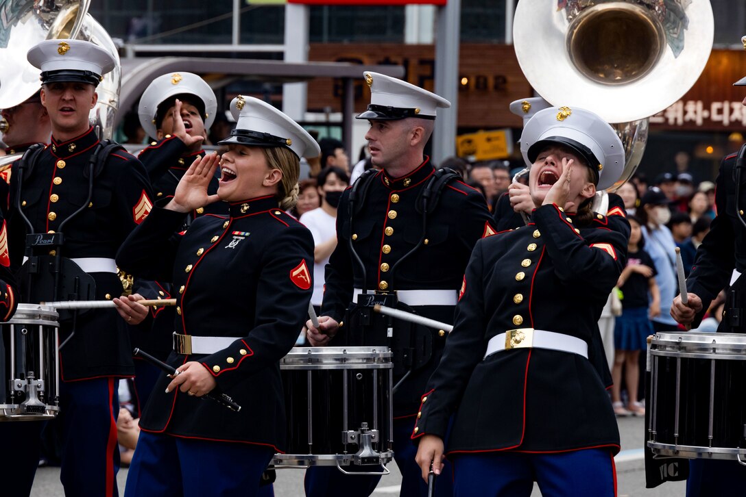 U.S. Marine Corps LCpl. Madison Hart, left, and Cpl. Paige Brokopp, both musicians with the III Marine Expeditionary Force Band, perform in a parade during the 2024 Pohang International Fire and Light Festival at Pohang Young-il-dae Beach, South Korea, June 1, 2024. The festival is held annually and provides attendees the opportunity to learn and experience the South Korean culture. The III MEF Band performed during the festival to enhance relationships with Pohang citizens. Hart is a native of Georgia and Brokopp is a native of Florida. (U.S. Marine Corps photo by Cpl. Stephen Holland)