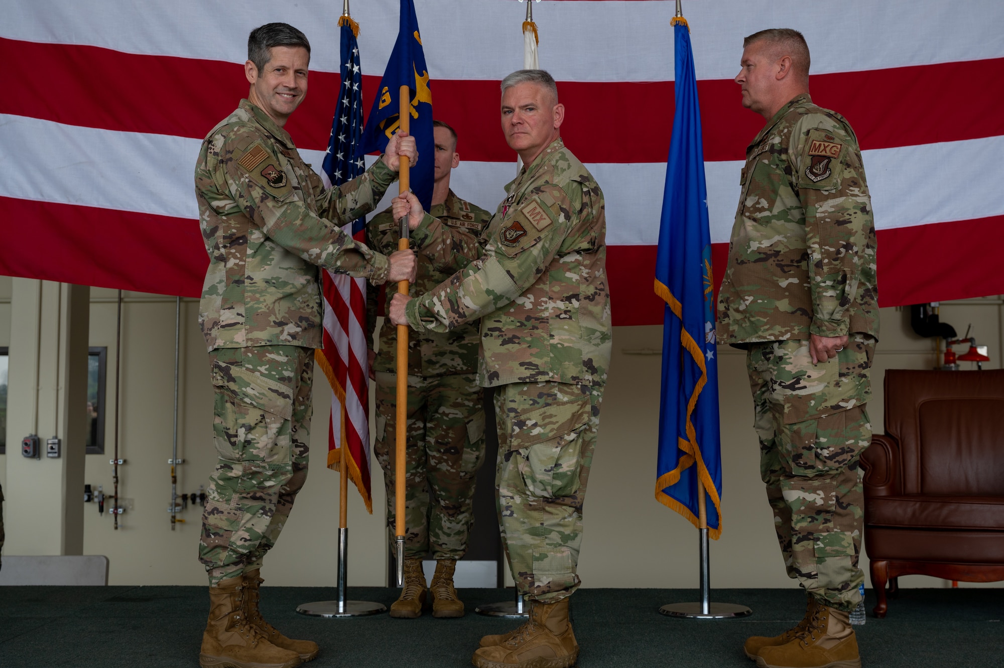 U.S. Air Force Col. Todd Wydra, relinquishes command of the 51st Maintenance Group to Col. William McKibban, 51st Fighter Wing commander, during a change of command ceremony at Osan Air Base, Republic of Korea, June 12, 2024. After relinquishing command, Wydra will move to Wright Patterson Air Force Base, Ohio, to serve as the director of F-35 global sustainment. Change of command ceremonies are a long-standing military tradition that symbolize the official transfer of power and duties from the departing commander to the incoming commander. (U.S. Air Force photo by Airman 1st Class Chase Verzaal)