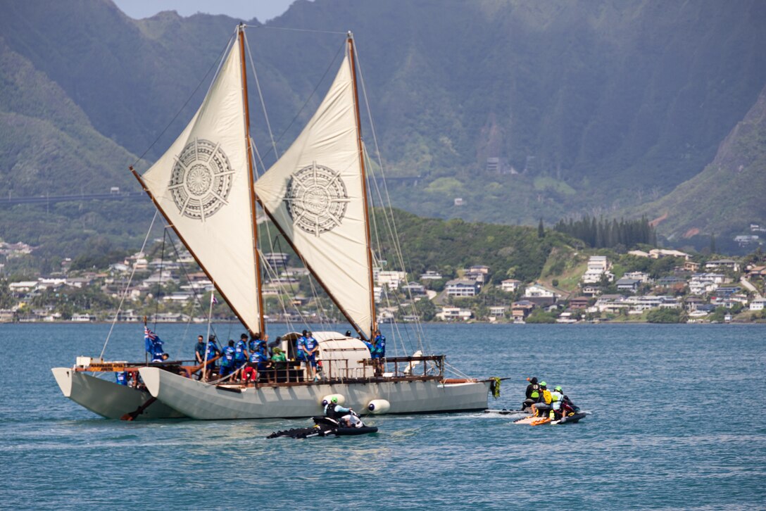 Vaka Marumaru Atua crew members depart from the Marine Corps Base Hawaii Marina on their way to the 2024 Festival of the Pacific Arts and Culture (FestPAC), MCBH, June 5, 2024. The visit consisted of a welcome ceremony, tours of the Hokule’a and Iosepa, and a dinner for crew members and guests after the Hokule’a and six of her sister canoes moored at the MCBH Marina. For the first time, Hawaii will host the FestPAC, which serves as a platform for cultural exchange, celebration of indigenous artistry, and the promotion of regional solidarity among Pacific nations. (U.S. Marine Corps photo by Lance Cpl. Carlos Daniel Chavez-Flores)