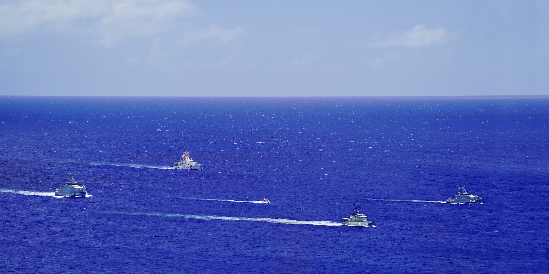 In a gathering of maritime allies, the Guardian-class patrol ships PSS President HI Remeliik II (001) from the Republic of Palau and FSS Bethwel Henry (P902) from the Federated States of Micronesia and alongside the Forum-class RMIS Lomor (03) from the Republic of the Marshall Islands, the crew of the USCGC Frederick Hatch (WPC 1143) and a Station Apra Harbor 29-foot Response Boat-Small conduct a formation sail off of Guam, June 7, 2024. This assembly marks the inaugural Operation Irensia, a collaborative effort led by the U.S. Coast Guard to enhance Pacific interoperability and coordinated regional efforts. Held from June 3-9, 2024, this operation underscores a shared commitment to building stronger partnerships and promoting security throughout the Pacific. (U.S. Coast Guard photo by Chief Warrant Officer Sara Muir