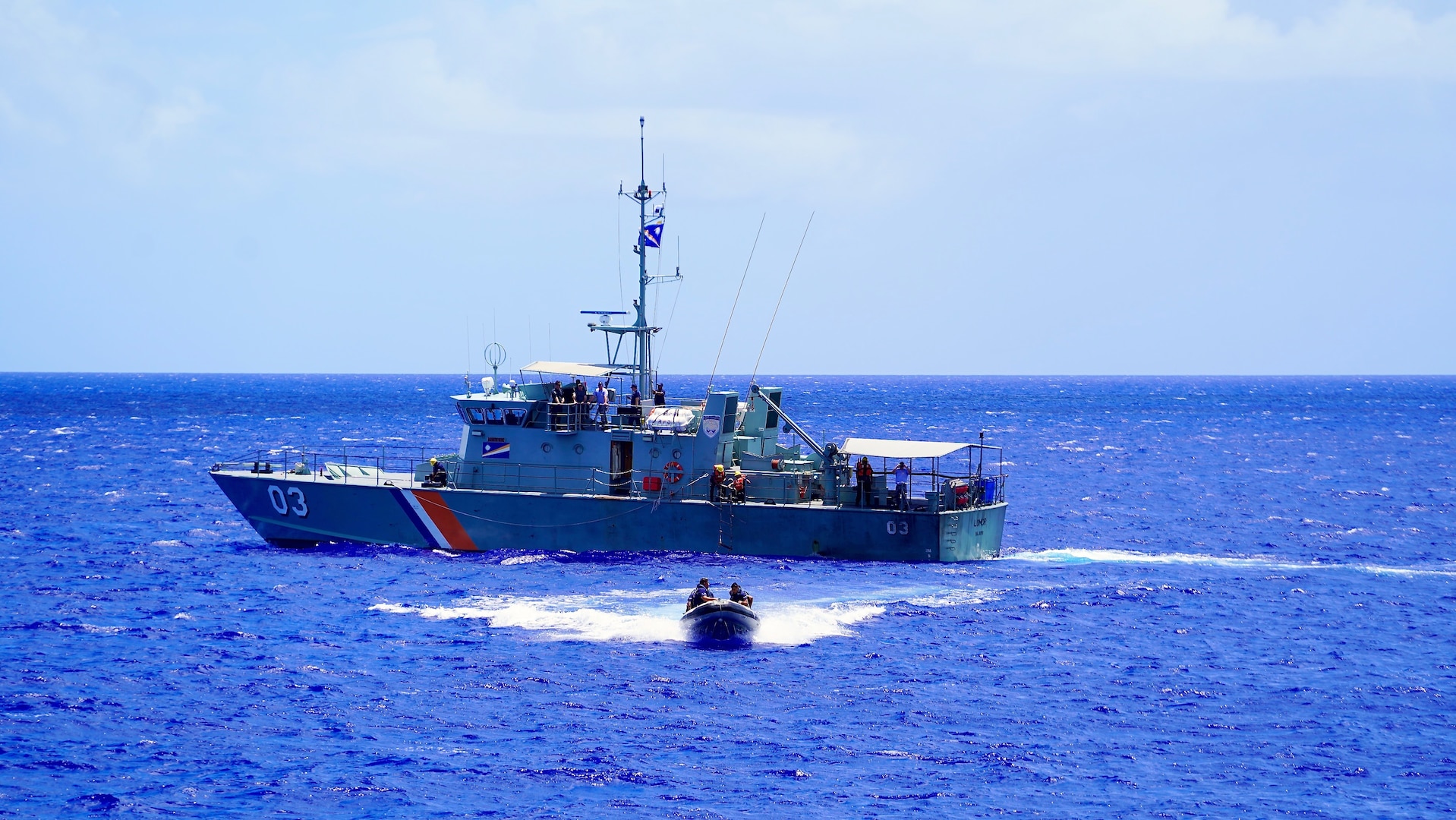 A team from the Republic of the Marshall Islands departs their vessel to run mock law enforcement boardings simulating coming aboard fishing vessels to ensure compliance with their nation’s regulations while offshore Guam on June 5, 2024, to build proficiency and exchange best practices. Participants from the Guardian-class patrol ships PSS President HI Remeliik II (001) from the Republic of Palau and FSS Bethwel Henry (P902) from the Federated States of Micronesia, the Forum-class RMIS Lomor (03) from the Republic of the Marshall Islands, along with members from the USCGC Oliver Henry (WPC 1140), USCGC Frederick Hatch (WPC 1143), U.S. Coast Guard Forces Micronesia, and U.S. Coast Guard Base Guam team, showcased their skills. The event, part of the inaugural Operation Irensia, was held with partners from the Royal Australian Navy and Australian Defence Force Pacific Maritime Security Program, highlighting the collaborative spirit and enhanced interoperability among Pacific allies from June 3-9, 2024. (U.S. Coast Guard photo by Chief Warrant Officer Sara Muir)