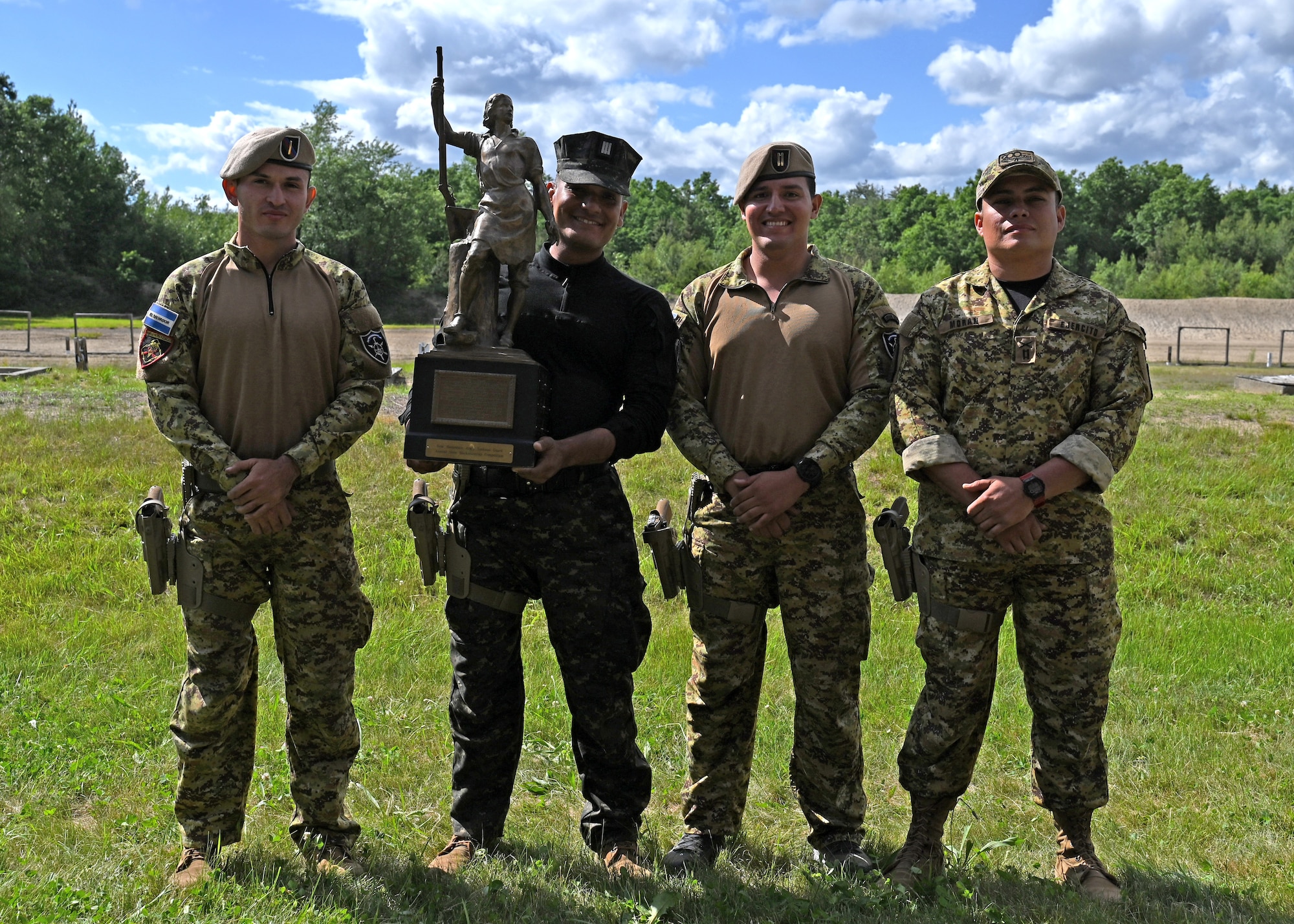 Team El Salvador hoists the Remington Centennial Trophy at the 2024 New Hampshire National Guard Combat Marksmanship Match June 8, 2024, at Fort Devens, Mass. The squad successfully defended its title as reigning champions. New Hampshire Army National Guard teams, "Cool-Guy Tabs Plus One" and "Call for Fire," placed second and third, respectively.