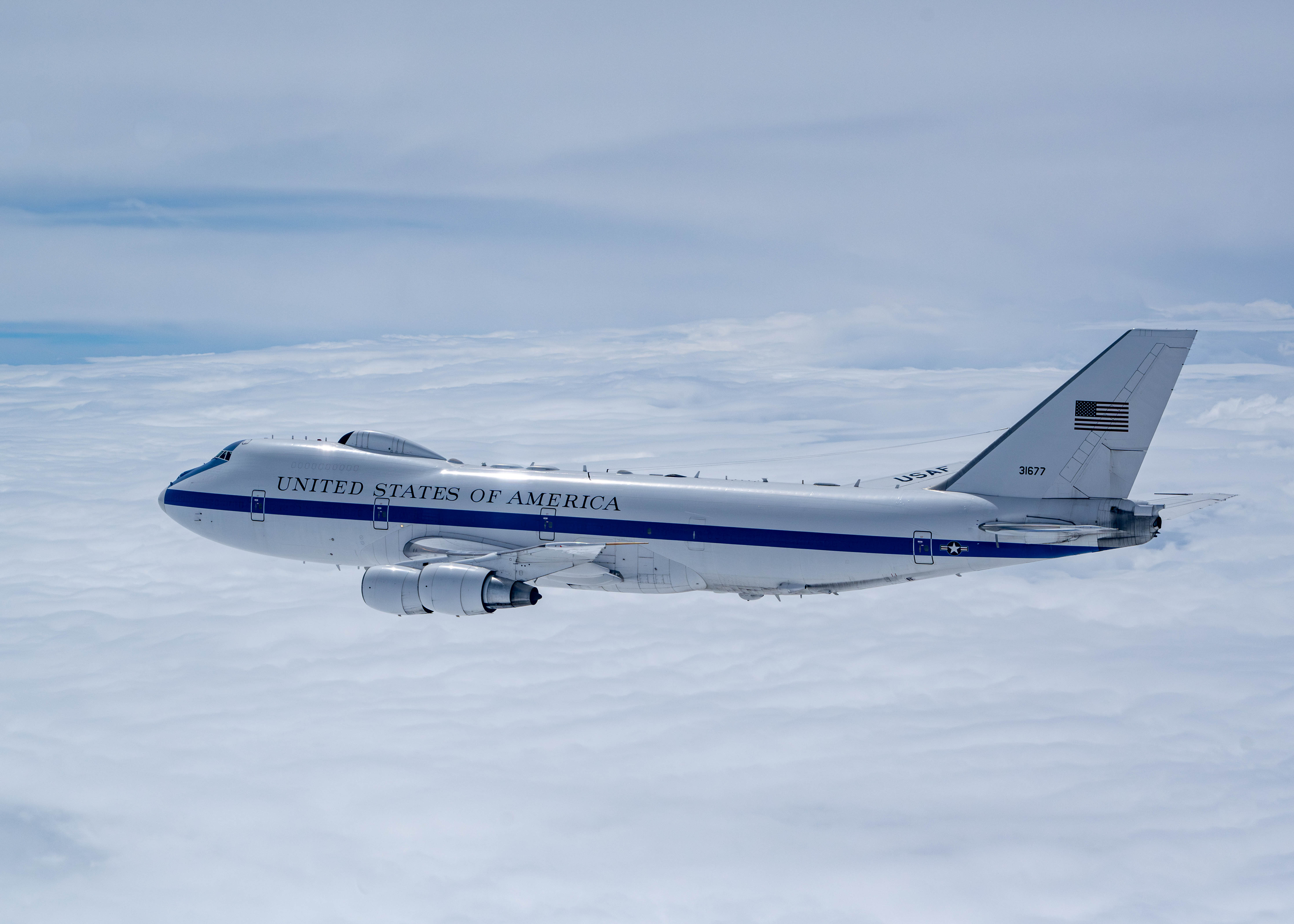 A U.S. Air Force E-4B assigned to the 595th Command and Control Group, Offutt Air Force Base, Neb., flies on a training sortie over the Midwest, May, 15, 2024. The E-4B is a militarized version of the Boeing 747-200, consisting of four engines, a swept-wing design, and capable of long-range, high-altitude operations and in-flight air refueling. (U.S. Air Force photo by Tech. Sgt. Codie Trimble)