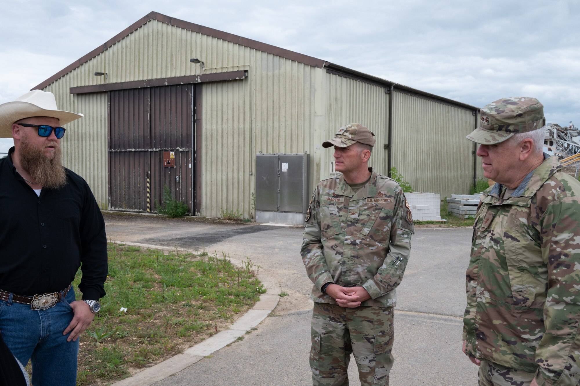 U.S. Air Force Maj. Gen. John J. Allen Jr., Air Force Installation and Mission Support Center commander, right, talks about the new hangar on RAF Fairford.
