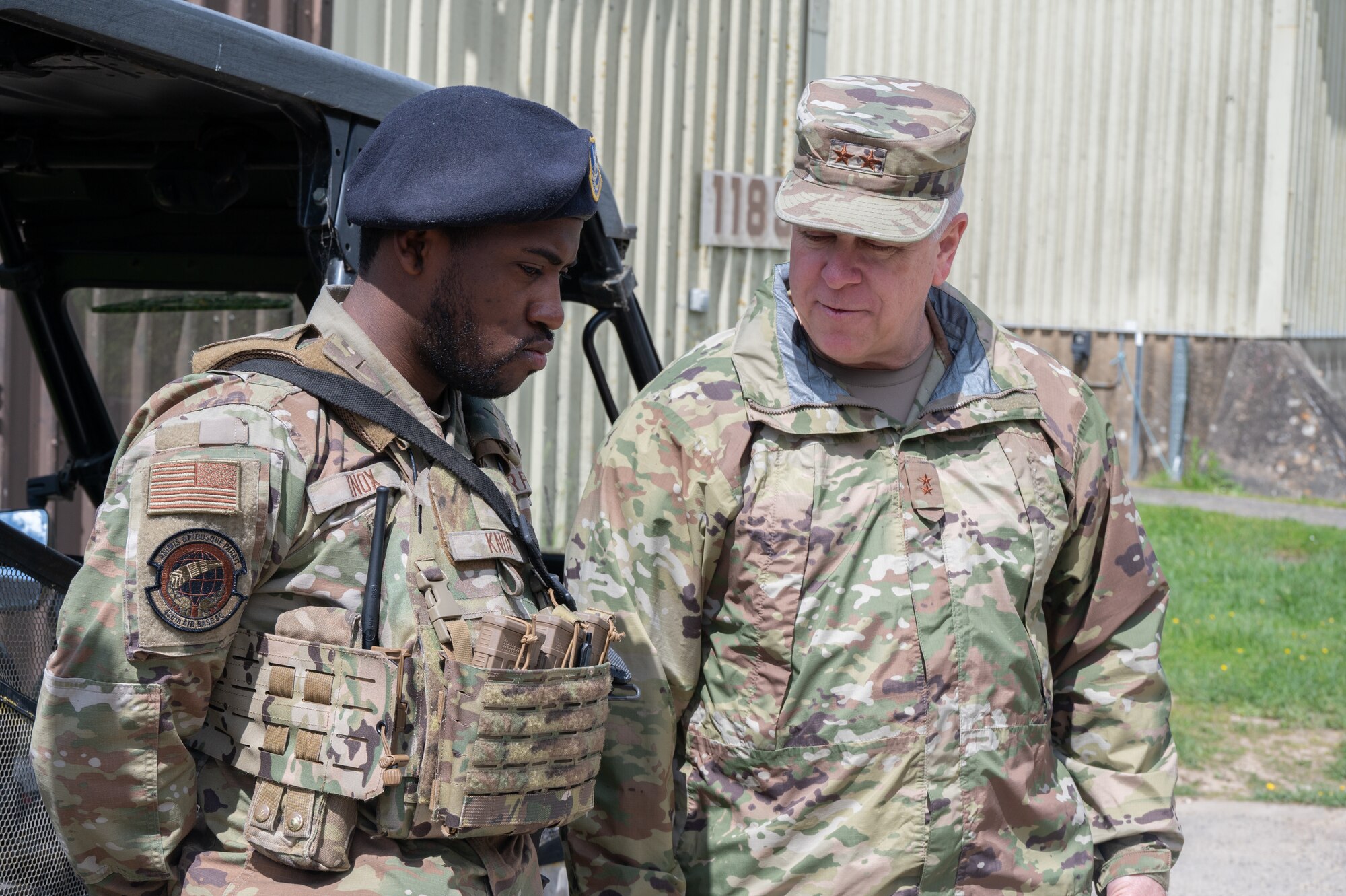 U.S. Air Force Maj. Gen. John J. Allen Jr., Air Force Installation and Mission Support Center commander, talks with a defender on RAF Fairford.