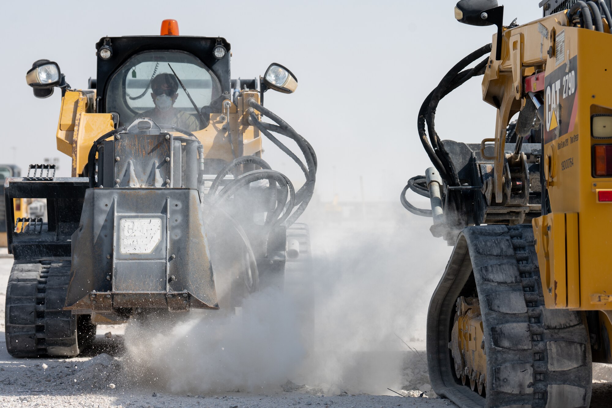 Pavement and construction equipment specialists assigned to the 379th Expeditionary Civil Engineer Squadron enlarge a simulated crater in an airfield at an undisclosed location within the U.S. Central Command area of responsibility, June 12, 2024.