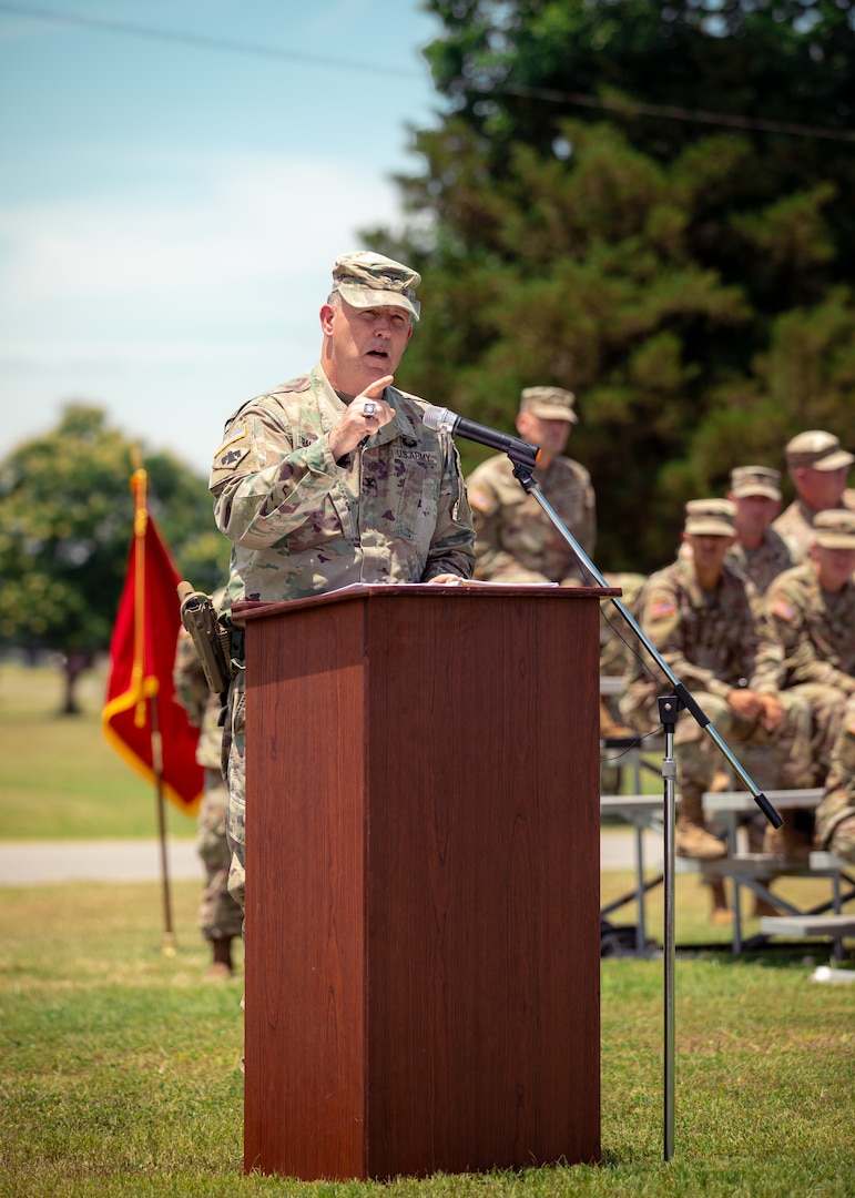 Col. Andrew Ballenger, outgoing commander of the 45th Infantry Brigade Combat Team, Oklahoma Army National Guard, speaks during a change of command ceremony between him and the IBCT’s incoming commander, Col. Khalid Hussein, at Camp Gruber Training Center near Braggs, Oklahoma, June 11, 2024. Ballenger commanded the 45th IBCT since August 2022, leading the brigade through numerous deployments and training exercises, enhancing its readiness and operational capabilities. (Oklahoma National Guard photo by Cpl. Danielle Rayon)