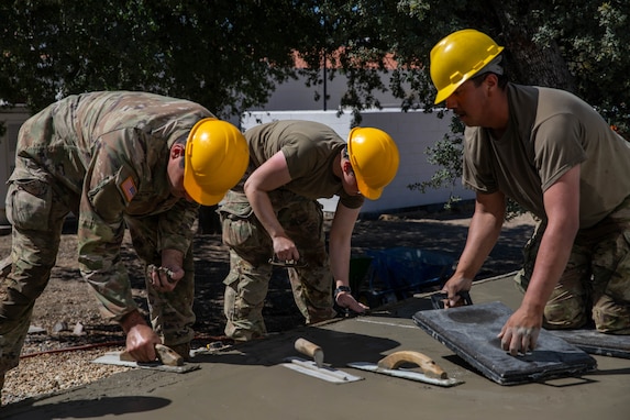 Engineer Soldiers build concrete paths at annual training