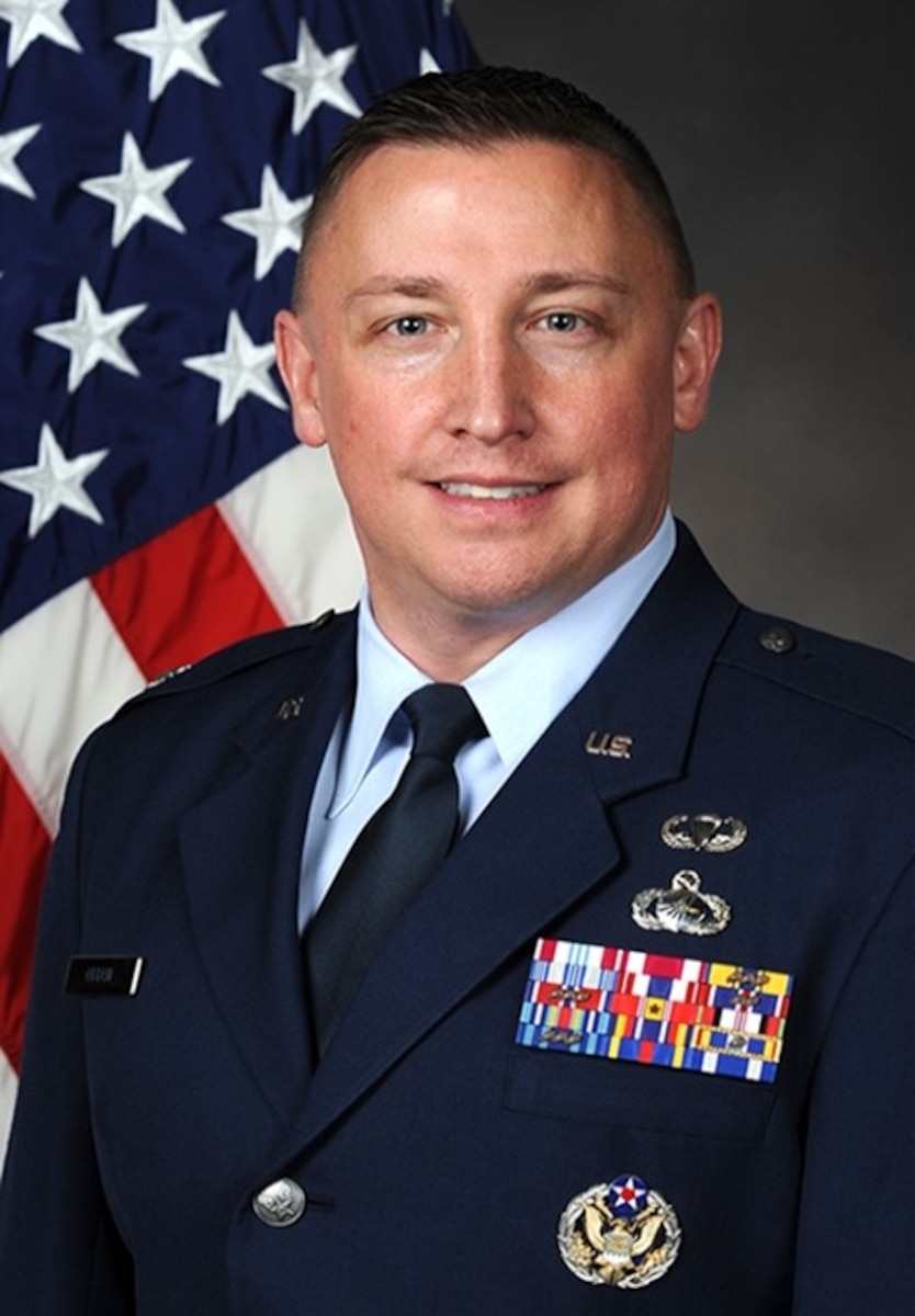 White man in USAF dress blue uniform. Rank of Colonel.