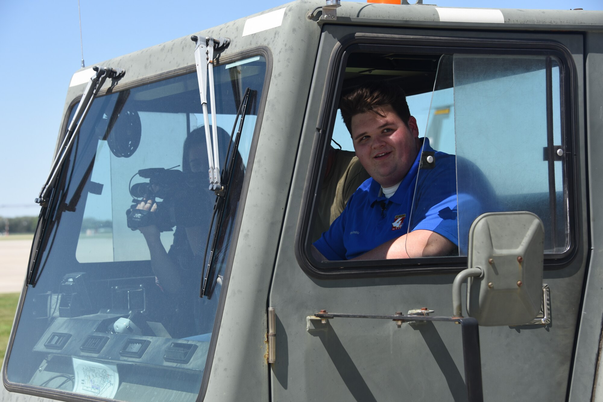 KTIV meteorologist, Jacob Howard drives the tug.