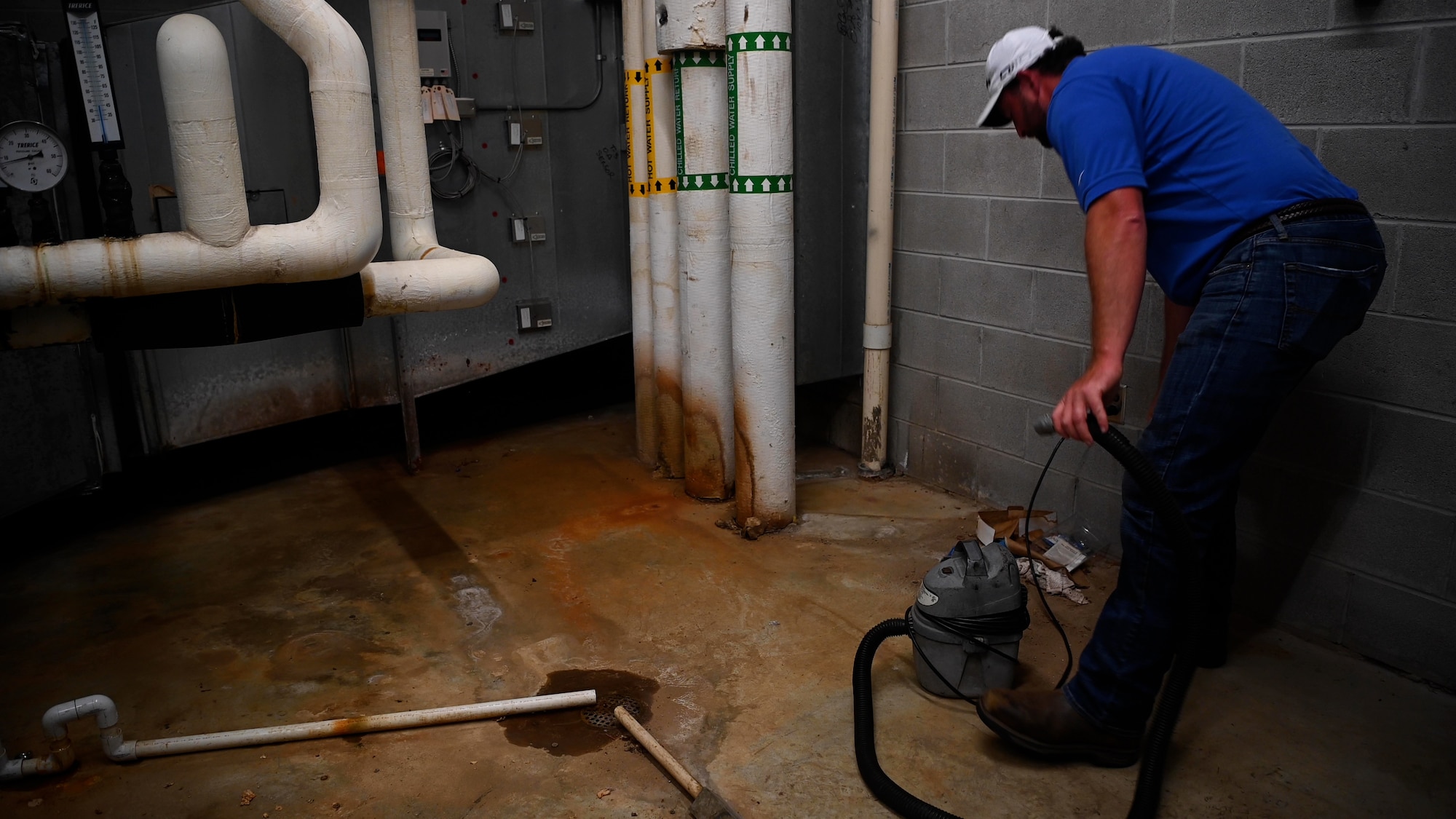 Clay Corley, HVAC technician drains air conditioner unit. The 42nd CE team is on call 24/7/365 to address urgent issues prioritizing life, health, and safety. This includes handling live power line incidents, major water leaks, or complete HVAC failures