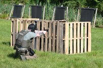 A U.S. Marshal conducts training on a firing range at Fort Indiantown Gap, Pa., June 12, 2024. About 30 U.S. Marshals from around the country conducted training on high-stress scenarios at Fort Indiantown Gap June 3 to 13. (Pennsylvania National Guard photo by Brad Rhen)