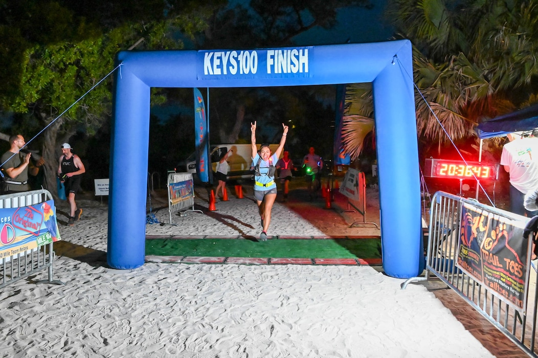 Diana M. Nogiec crosses the finish line after completing the Keys 100 Ultramarathon