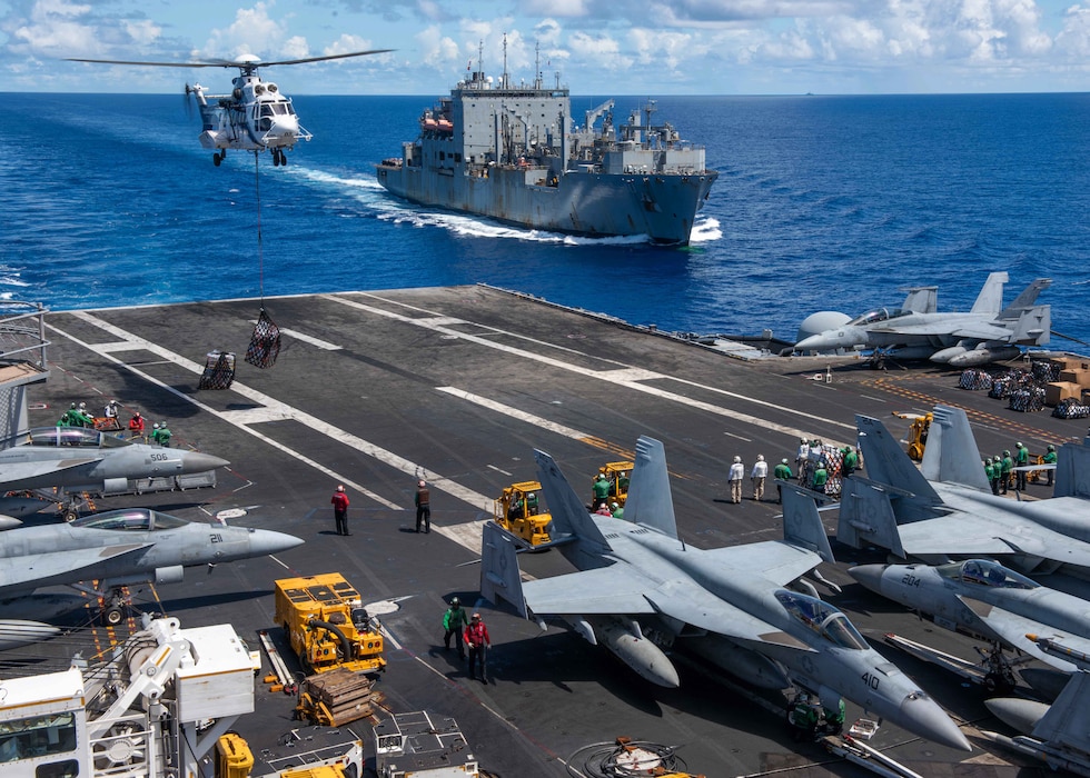 USS Ronald Reagan (CVN 76) conducts a replenishment-at-sea with USNS Rappahannock (T-AO 204) in the Philippine Sea.