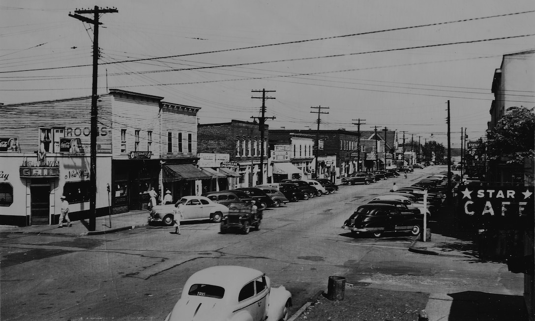 Business can be seen stretching down the street of Potomac Avenue.