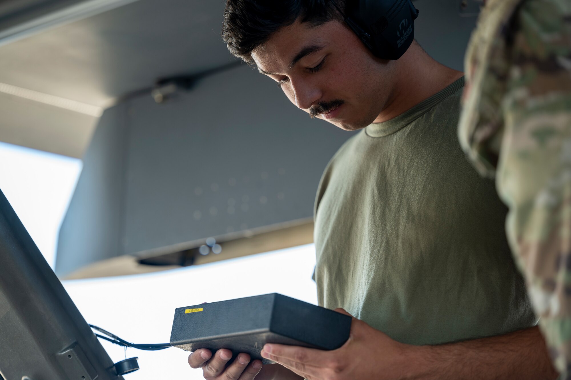 U.S. Air Force Senior Airman Garcia, 49th Aircraft Maintenance Squadron crew chief, uses a Vibration Analyzer box on an MQ-9 Reaper at Holloman Air Force Base, New Mexico, June 11, 2024.