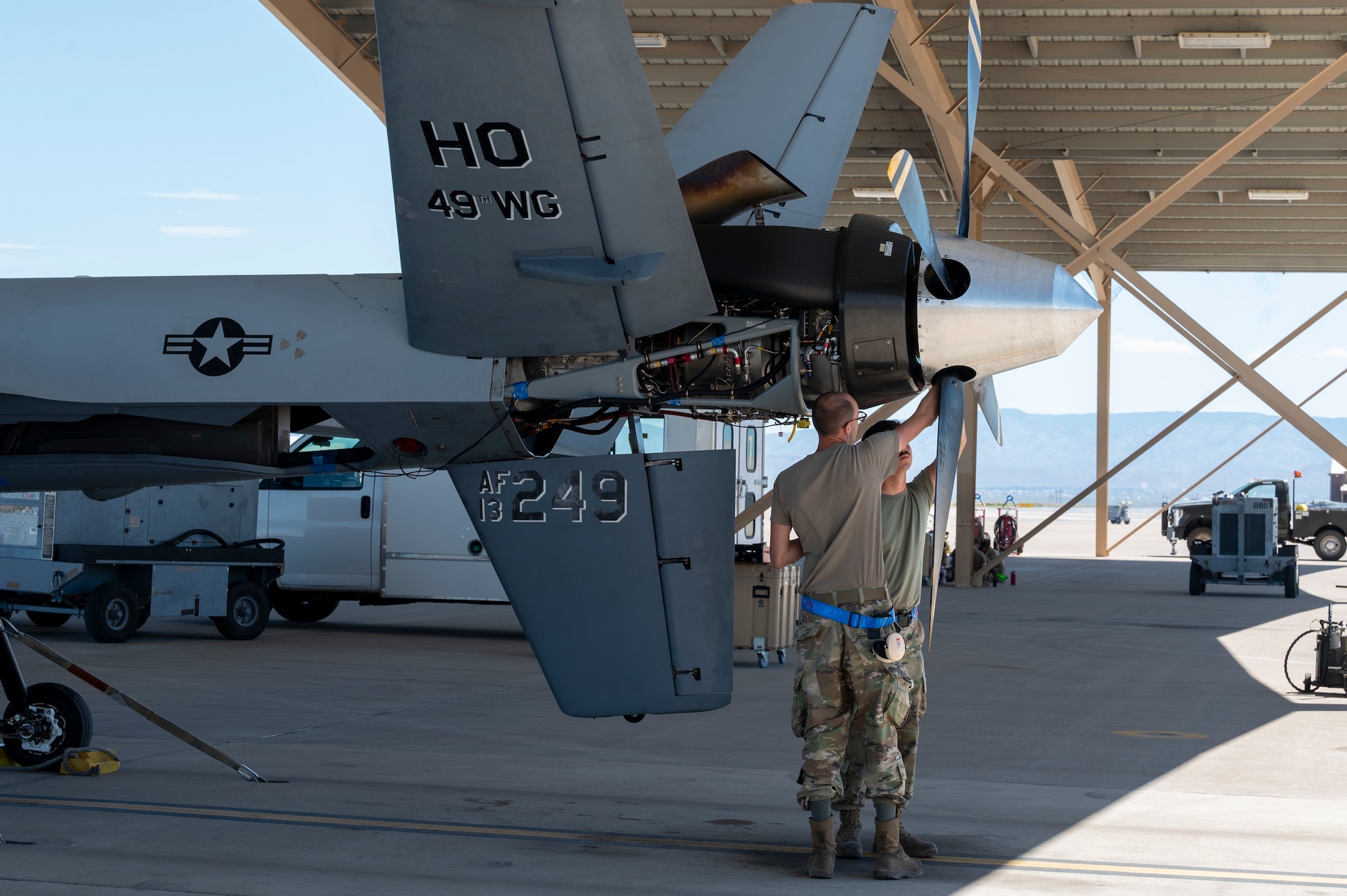 Airmen from the 49th Aircraft Maintenance Squadron perform maintenance on an MQ-9 Reaper at Holloman Air Force Base, New Mexico, June 11, 2024