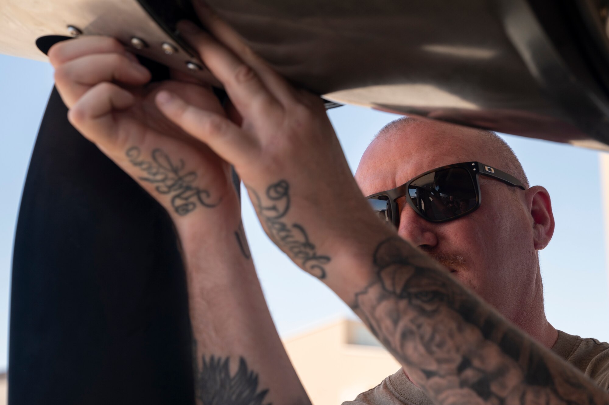 U.S. Air Force Tech. Sgt. Ryan Nixon, 49th Aircraft Maintenance Squadron crew chief, performs maintenance on an MQ-9 Reaper at Holloman Air Force Base, New Mexico, June 11, 2024.