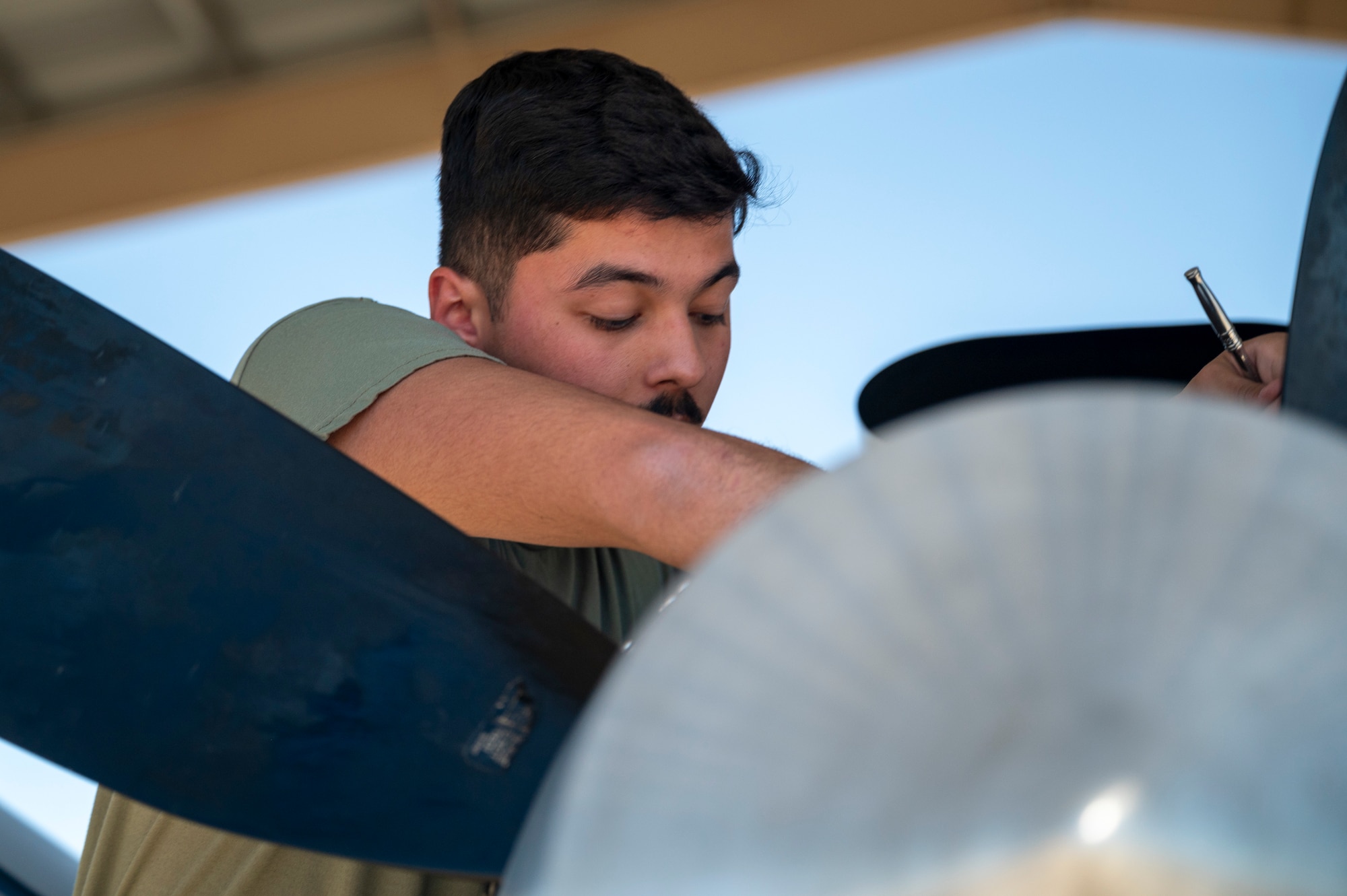 U.S. Air Force Senior Airman Jakob Garcia, 49th Aircraft Maintenance Squadron crew chief, performs maintenance on an MQ-9 Reaper at Holloman Air Force Base, New Mexico, June 11, 2024