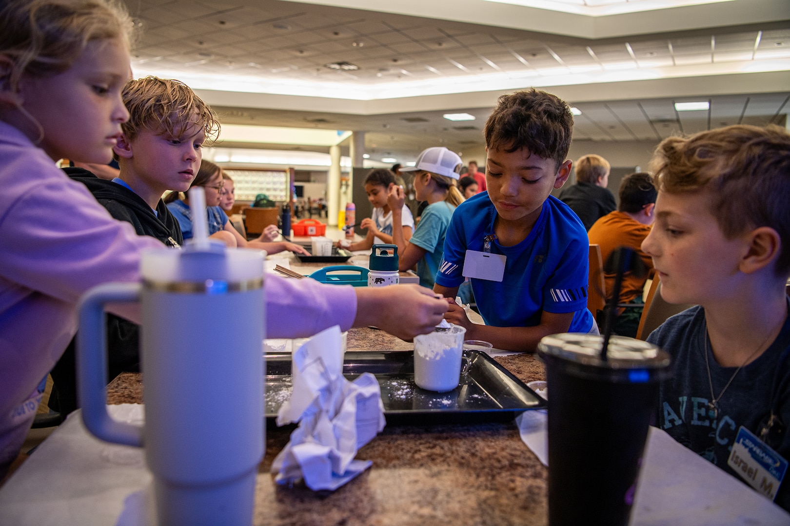 STARBASE Oklahoma City campers take part in a science experiment during the STARBASE OKC summer camp at Will Rogers Air National Guard Base in Oklahoma City, June 10, 2024. More than 50 children of Oklahoma National Guard members and Will Rogers Air National Guard base employees attended the camp where they took part in science experiments, built and coded robots to complete simple tasks, learned about computer-aided design, and met with National Guard members to hear how STEM education helped propel them on successful careers in the military. (Oklahoma National Guard photo by Anthony Jones)